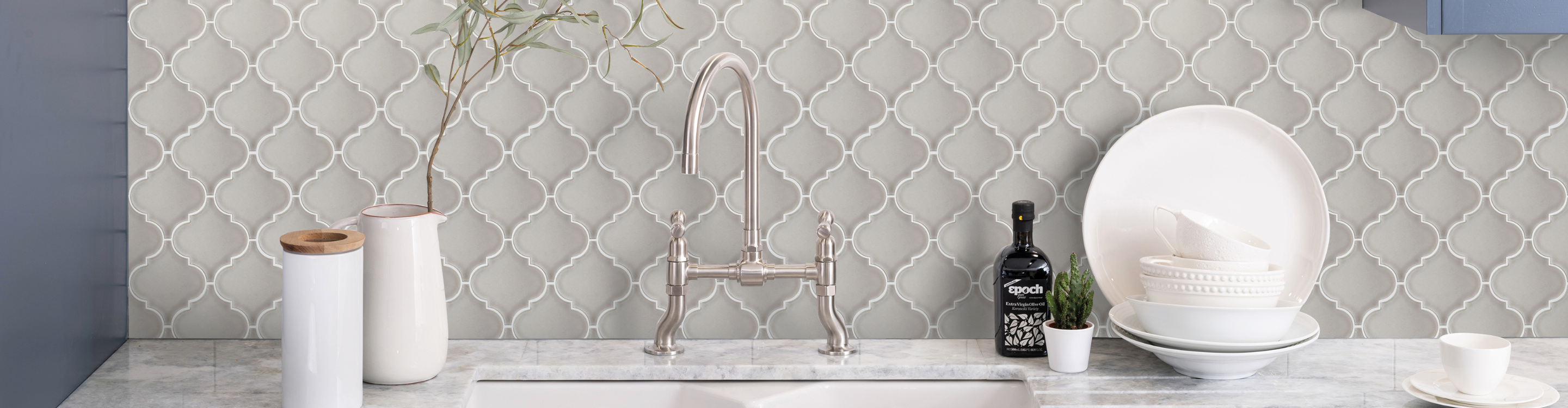 Grey tile backsplash in bathroom sink 